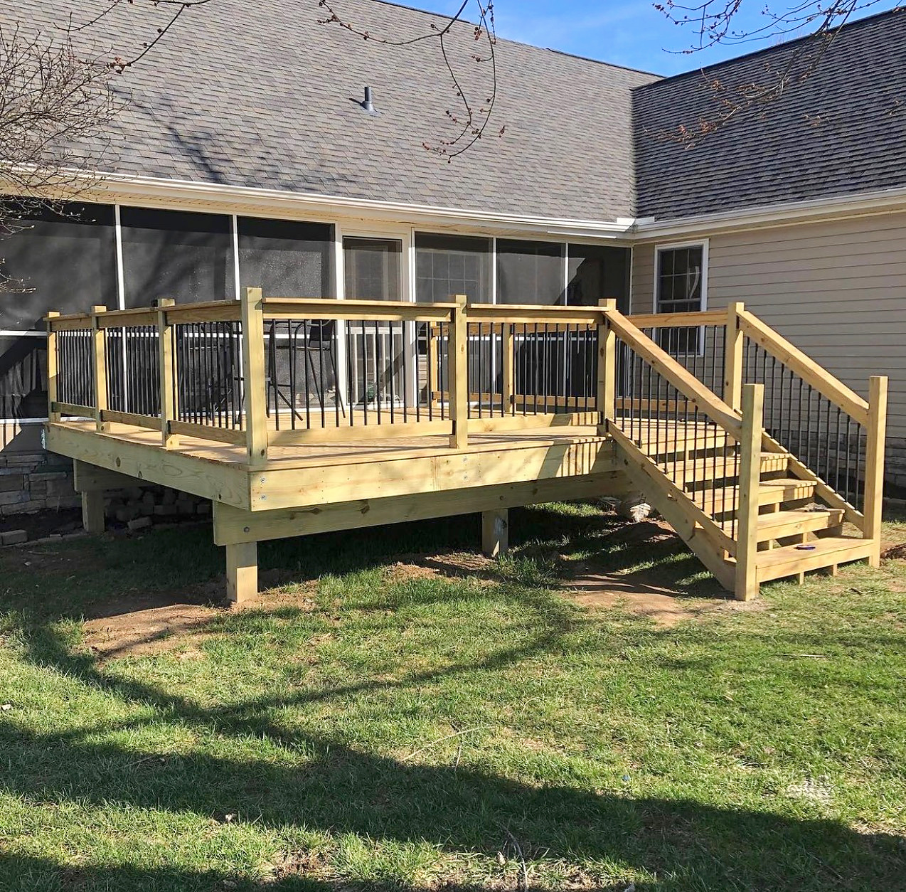 Multi-level deck addition off a screened porch
