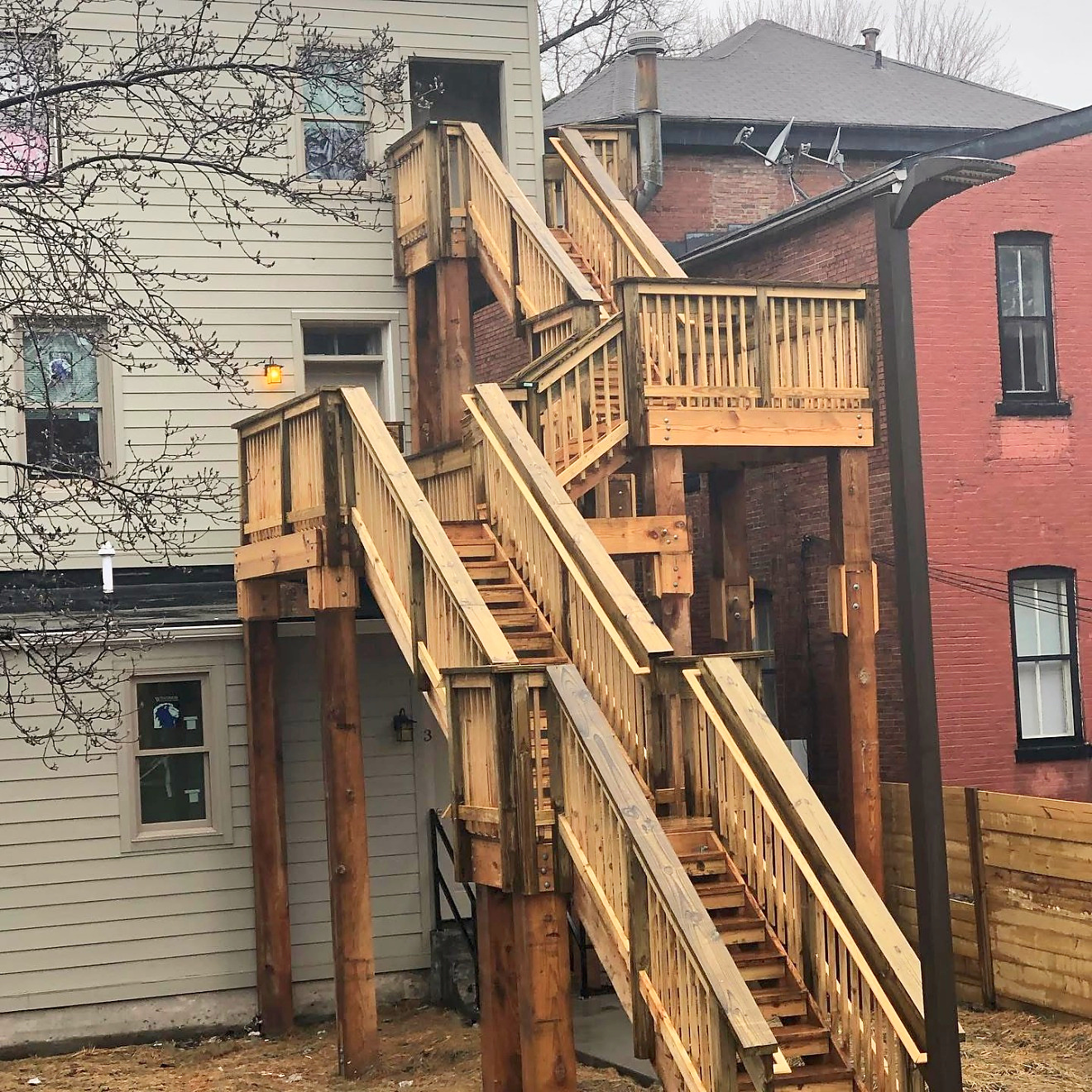Multi-story exterior stair and landing system in fresh timber